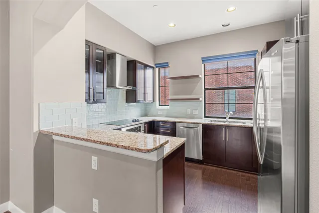 a kitchen with a refrigerator and a sink