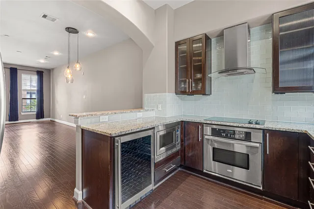 a kitchen with a stove and a microwave