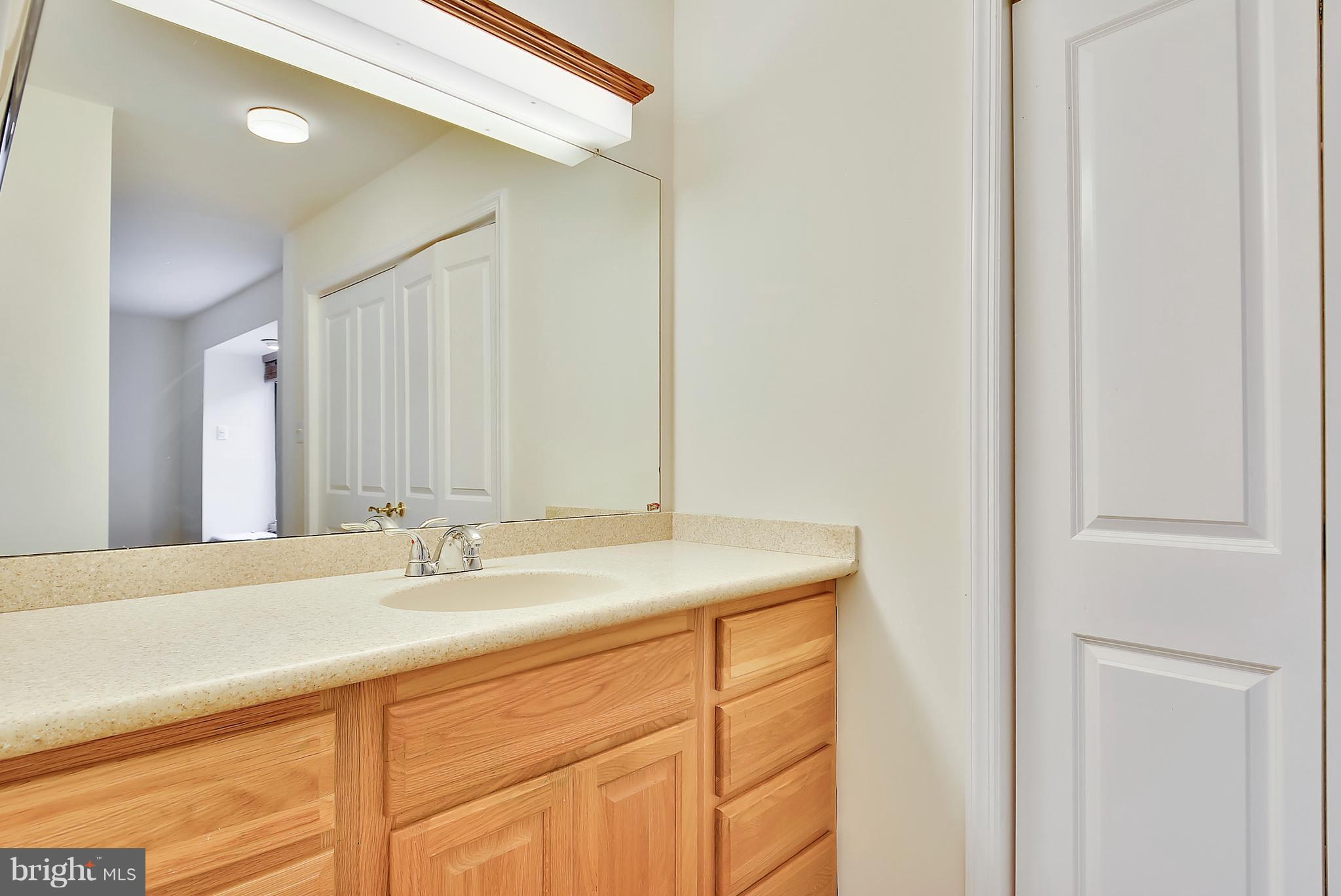 2019 Sarazen Place Reston, VA 20191 - Photo 16 of 30 master bath has large corian topped vanity