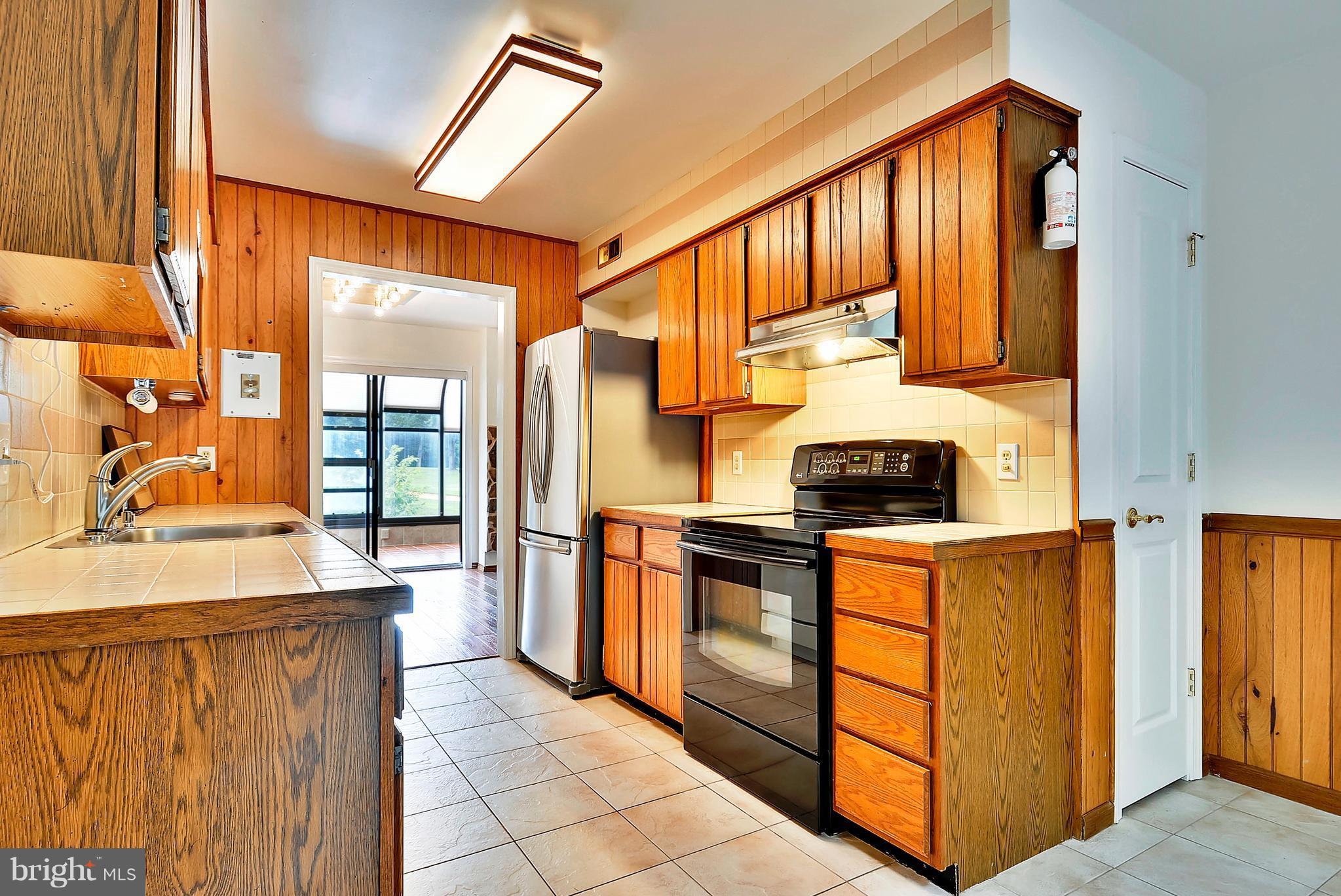 2019 Sarazen Place Reston, VA 20191 - Photo 3 of 30 Natural light pervades the kitchen