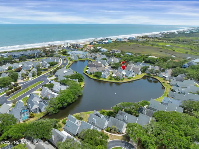 an aerial view of residential houses with outdoor space
