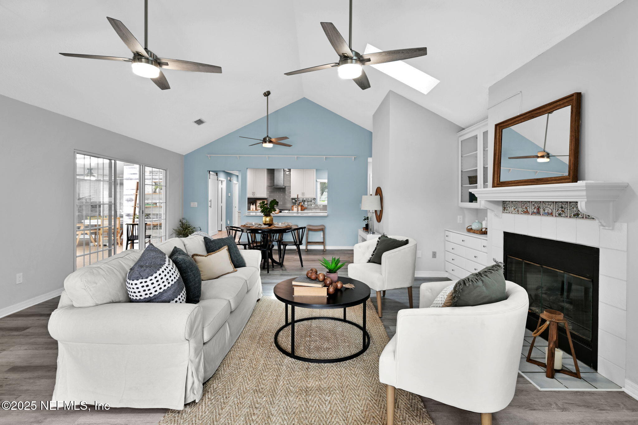 107 Hammock Circle St. Augustine, FL 32084 - Photo 14 of 76 a living room with furniture a fireplace and a ceiling fan