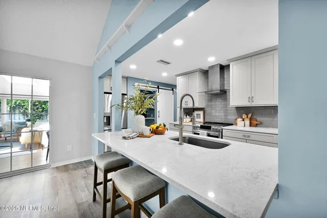 a swimming pool with outdoor seating and garden