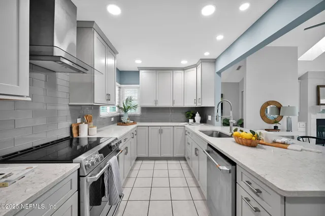 a view of a house with a yard and a pond