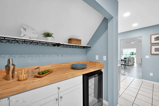 an aerial view of a house with a lake view