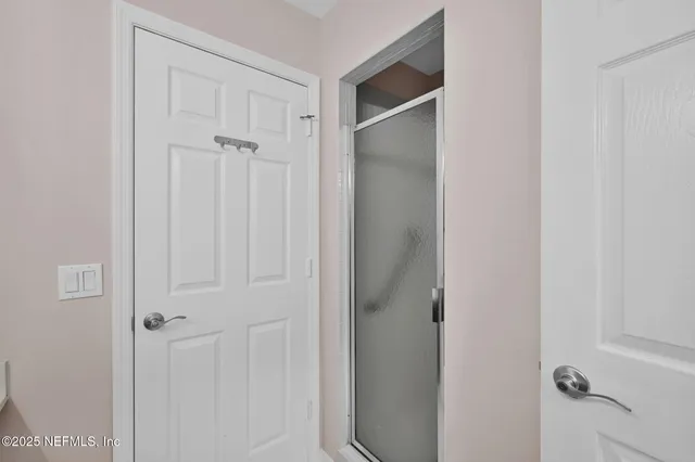 an aerial view of a house with a ocean view