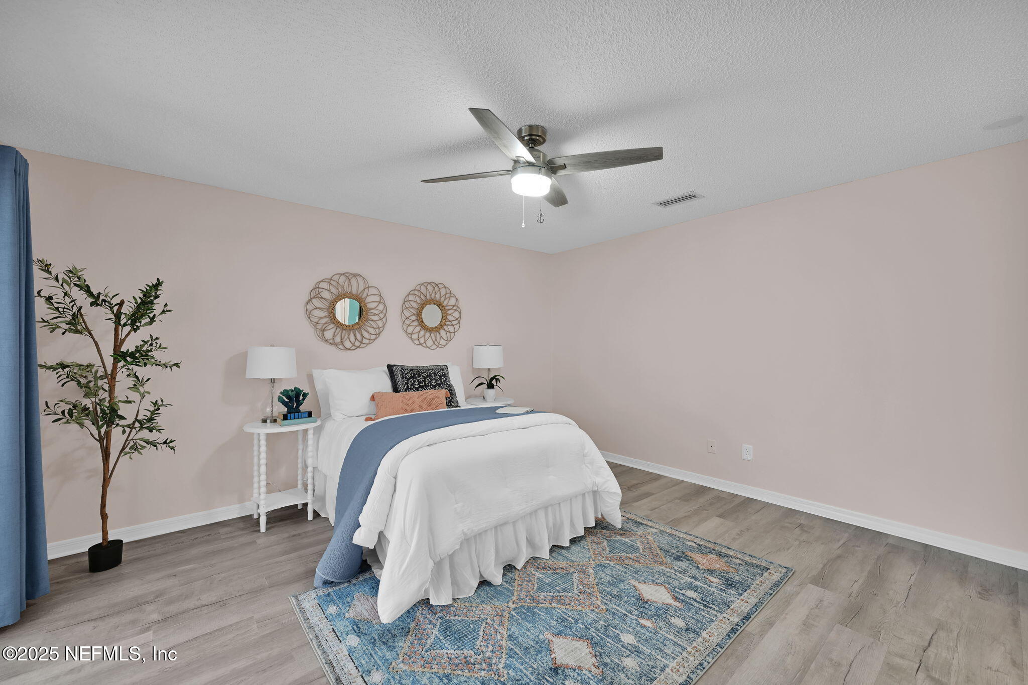 107 Hammock Circle St. Augustine, FL 32084 - Photo 33 of 76 a room with a bed and a chandelier