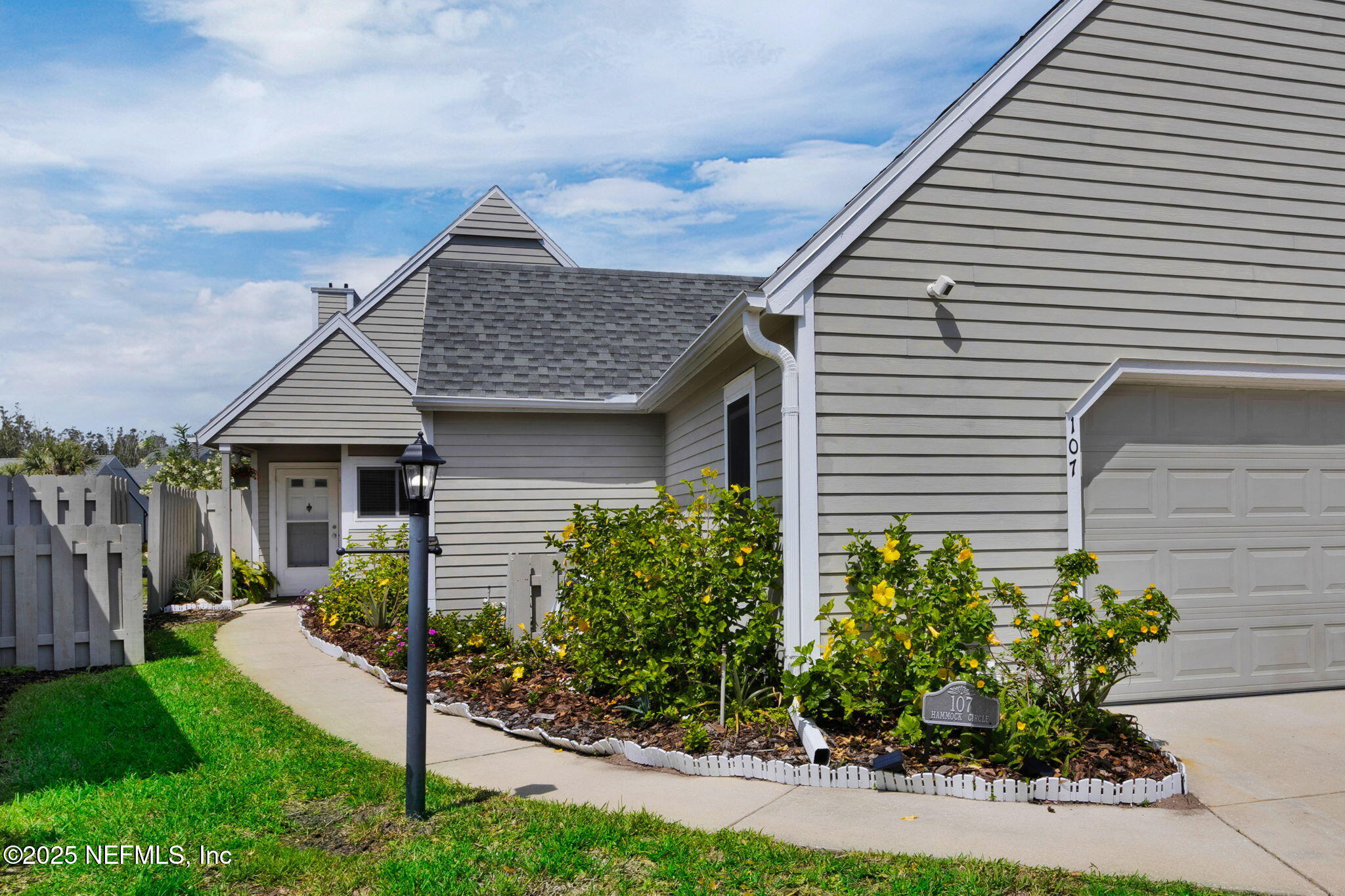 107 Hammock Circle St. Augustine, FL 32084 - Photo 5 of 76 a front view of a house with garden