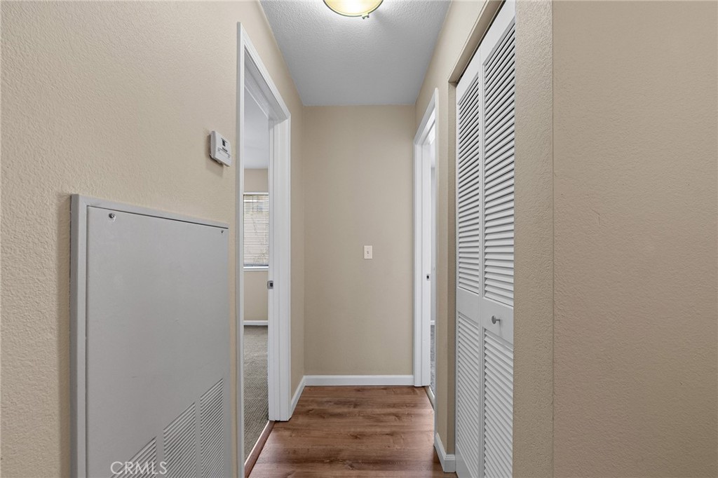 1114 Nord Avenue, Unit 17 Chico, CA 95926 - Photo 11 of 40 a view of a hallway with wooden floor and staircase