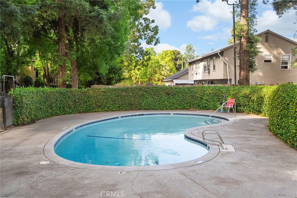 1114 Nord Avenue, Unit 17 Chico, CA 95926 - Photo 33 of 40 a view of a house with swimming pool and garden