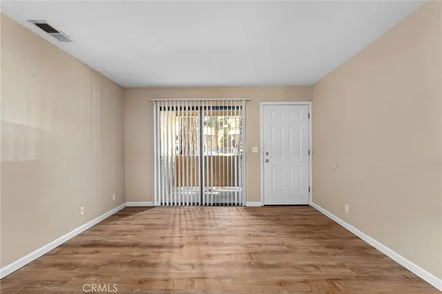 a kitchen with stainless steel appliances kitchen island granite countertop a sink stove and microwave