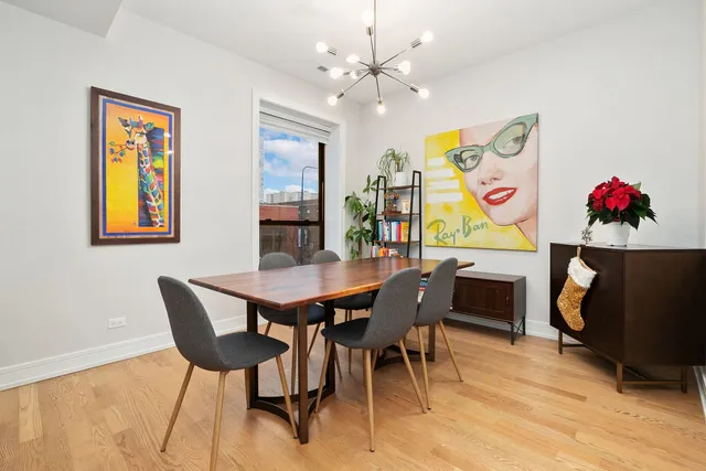 a bedroom with double bed and a flat tv screen