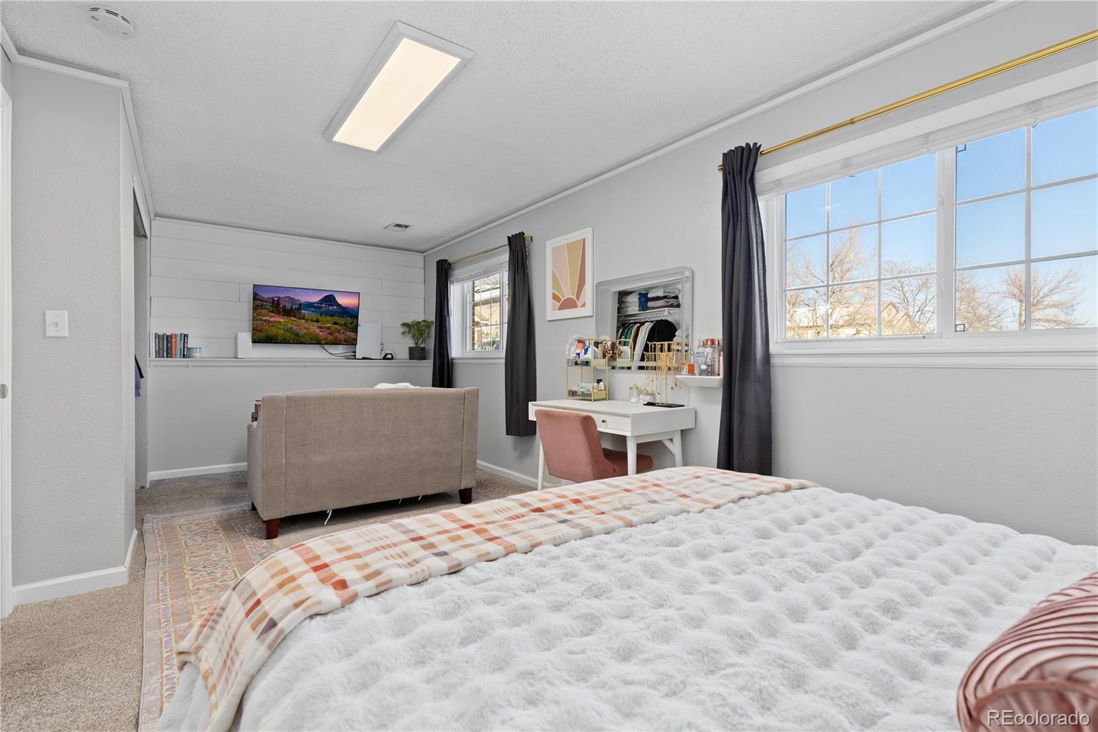 9364 Cattail Court Highlands Ranch, CO 80126 - Photo 19 of 31 a bedroom with a bed and a large window
