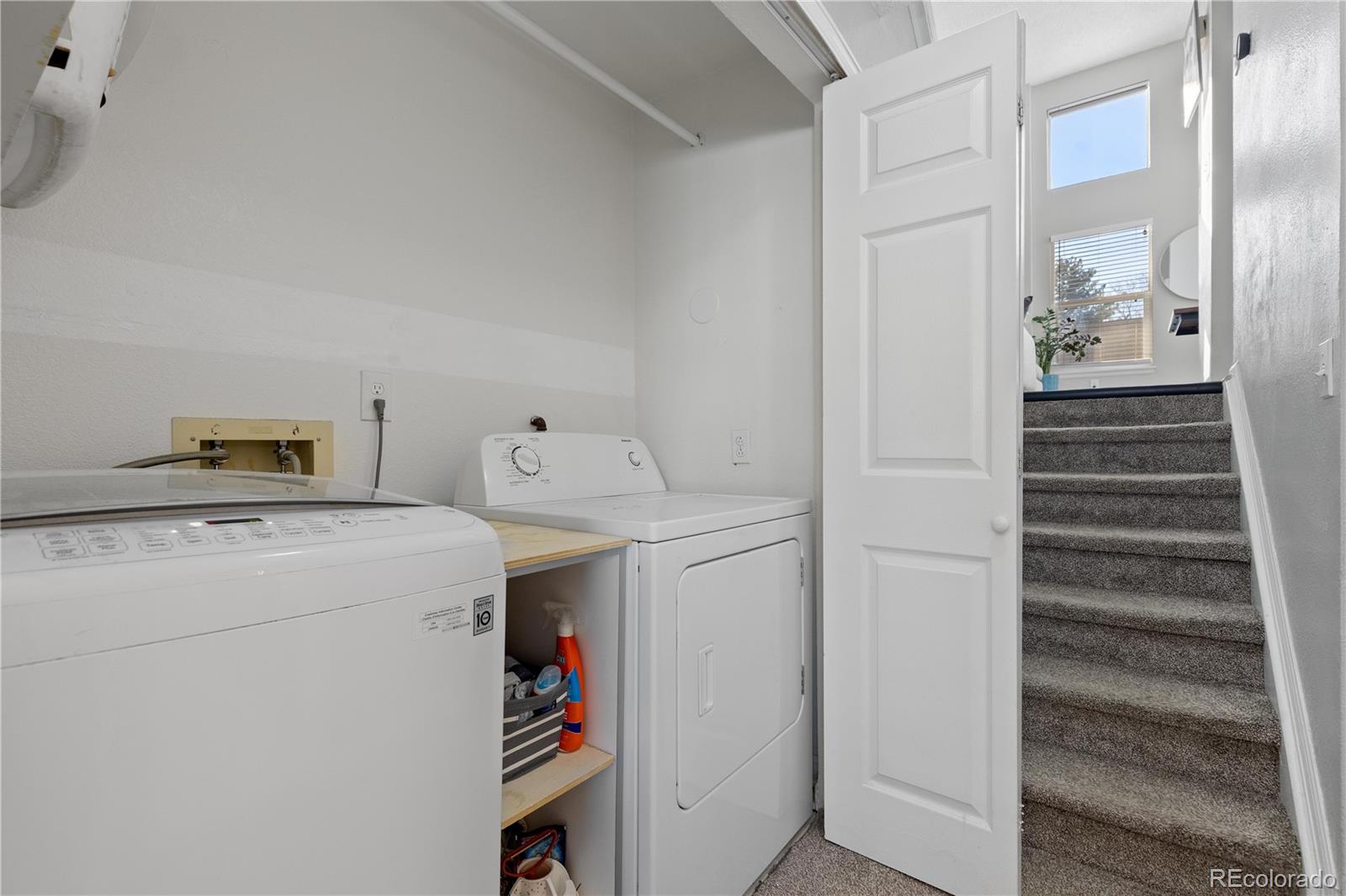 9364 Cattail Court Highlands Ranch, CO 80126 - Photo 22 of 31 a utility room with dryer and washer