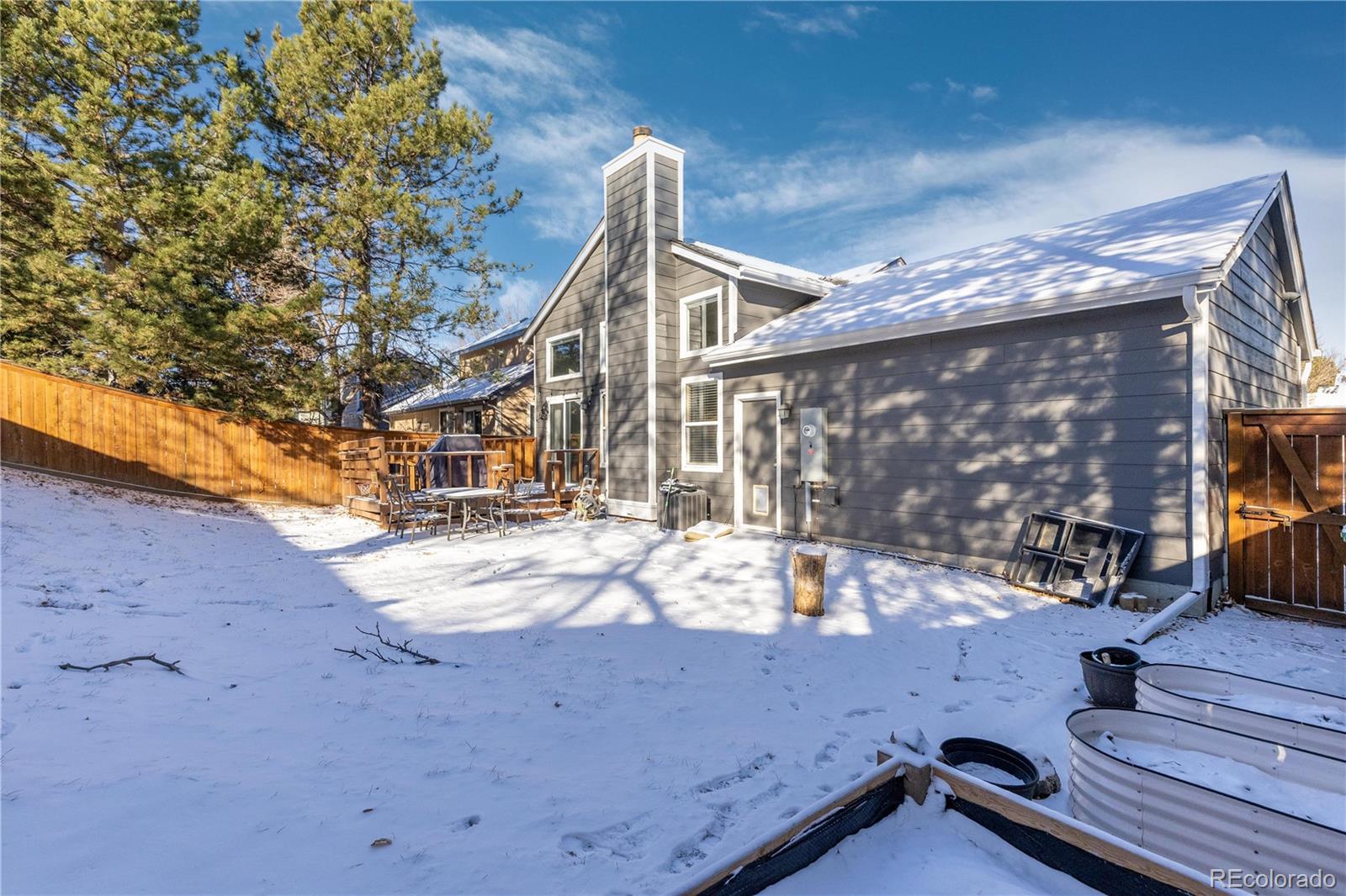 9364 Cattail Court Highlands Ranch, CO 80126 - Photo 25 of 31 a view of roof deck with a barbeque and wooden stairs