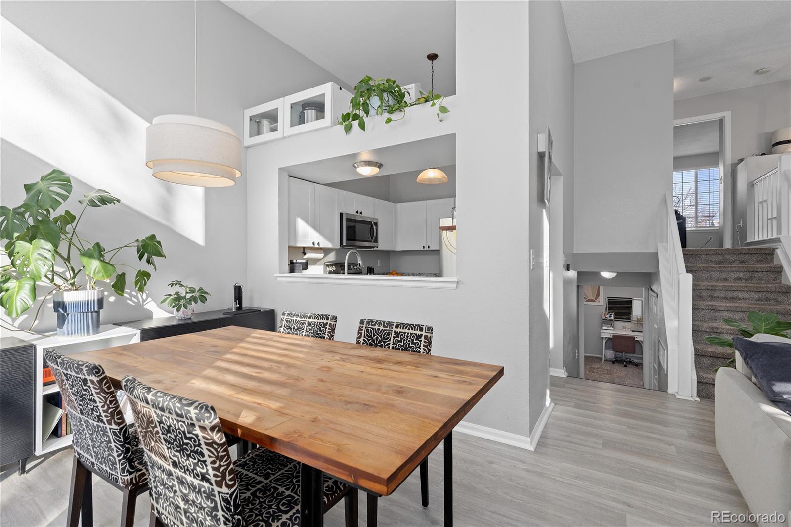 9364 Cattail Court Highlands Ranch, CO 80126 - Photo 10 of 31 a dining room with a table and chairs