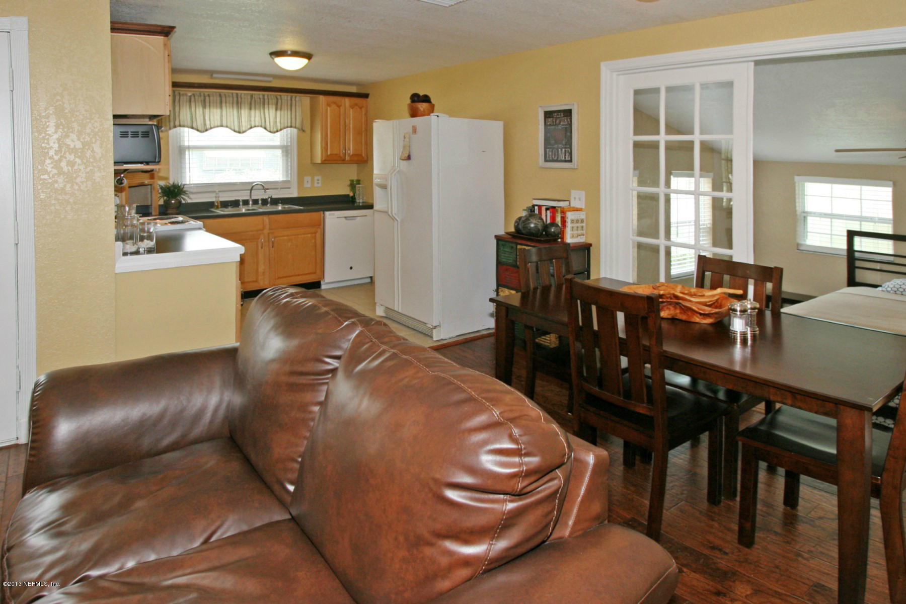 901 Palermo Road St. Augustine, FL 32086 - Photo 18 of 18 a living room with stainless steel appliances furniture a dining table and kitchen view