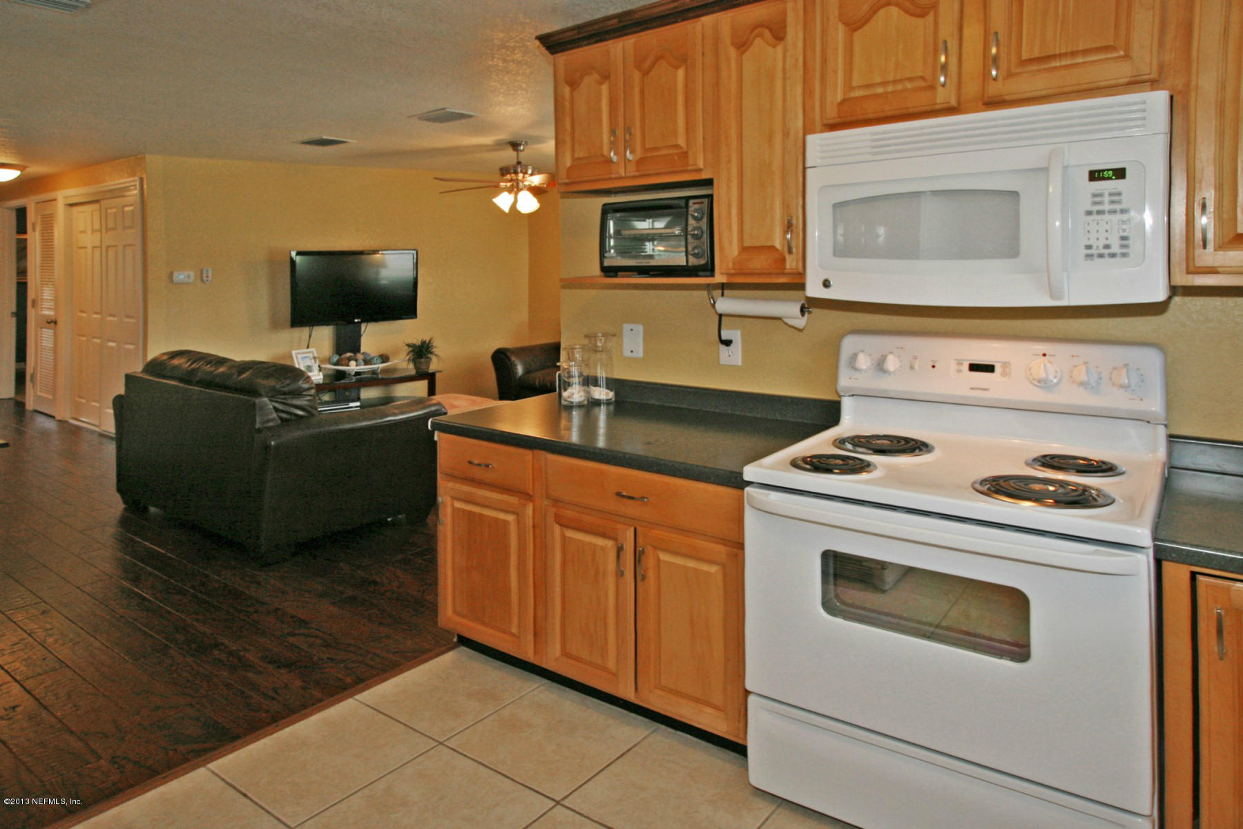 901 Palermo Road St. Augustine, FL 32086 - Photo 5 of 18 a kitchen with stainless steel appliances a stove a microwave and a cabinets