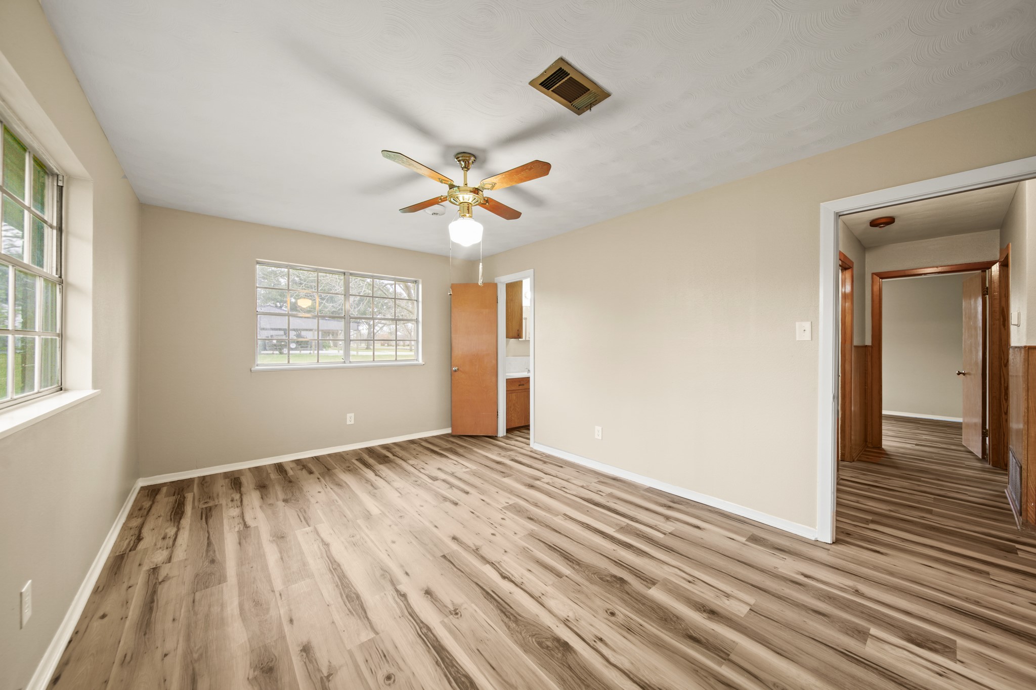 1438 County Road 348 Brazoria, TX 77422 - Photo 19 of 25 wooden floor in an empty room with a window