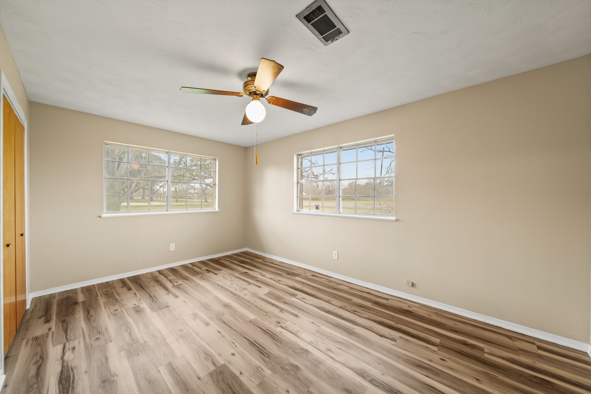 1438 County Road 348 Brazoria, TX 77422 - Photo 21 of 25 a view of room with hardwood floor and window