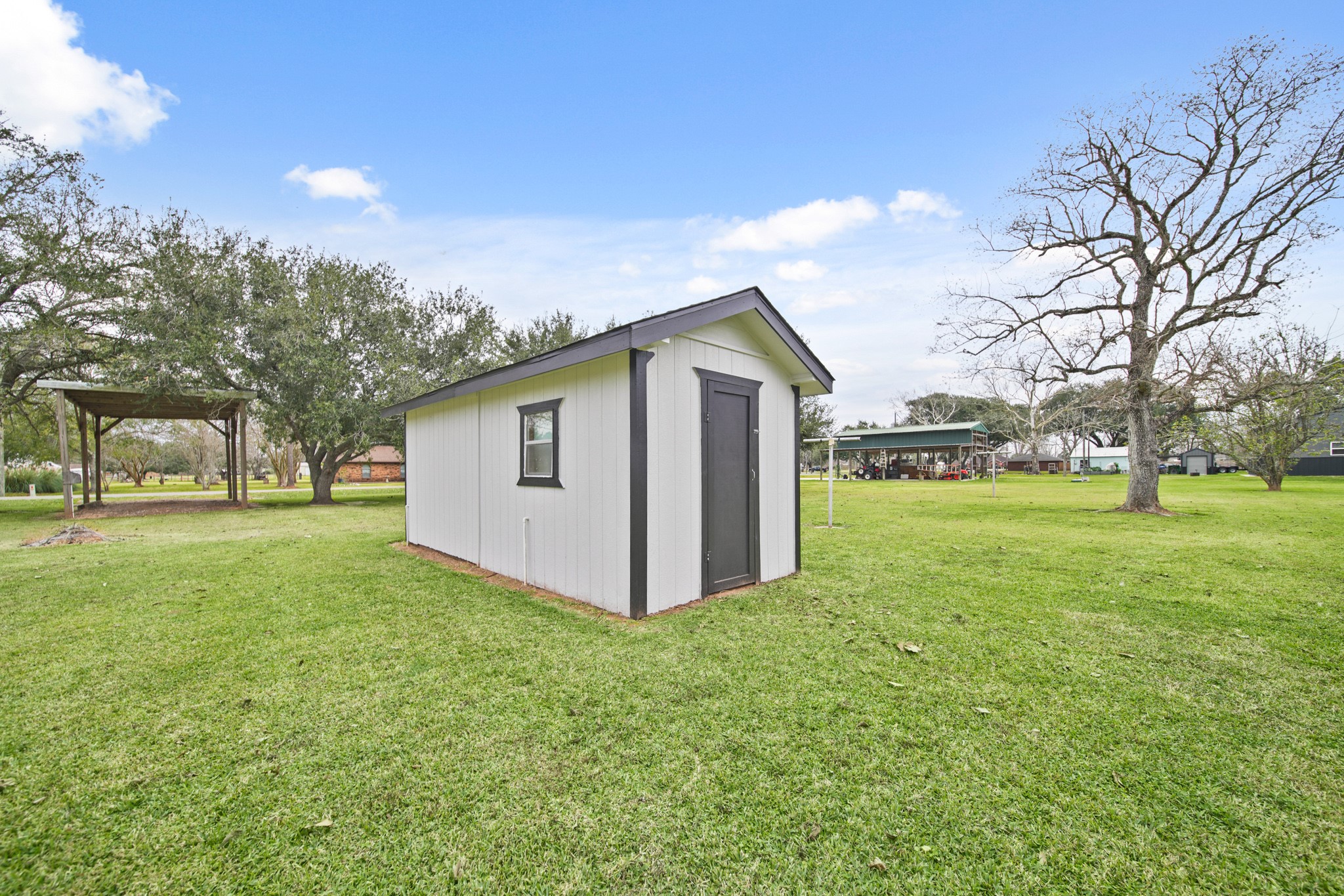 1438 County Road 348 Brazoria, TX 77422 - Photo 4 of 25 a view of a house with backyard and trees