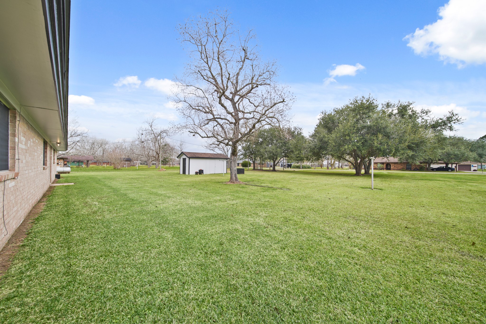 1438 County Road 348 Brazoria, TX 77422 - Photo 7 of 25 a view of grassy field with benches
