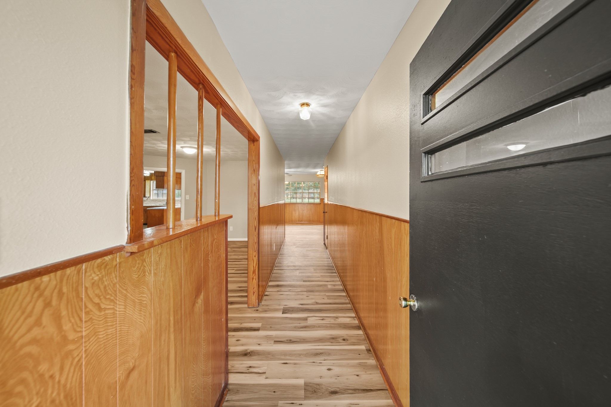 1438 County Road 348 Brazoria, TX 77422 - Photo 8 of 25 a view of a hallway with wooden floor and stairs
