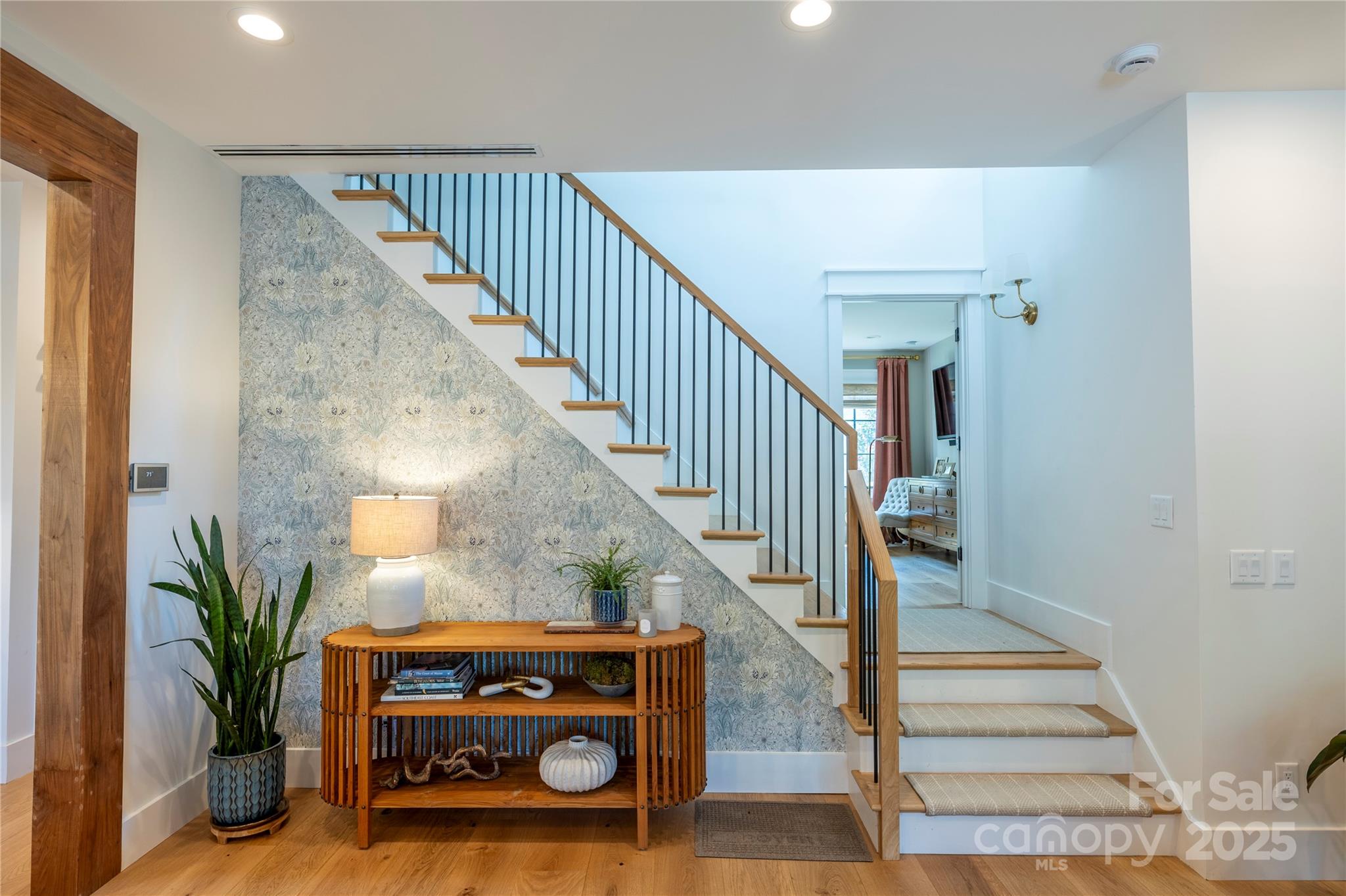 18353 John Connor Road Cornelius, NC 28031 - Photo 13 of 47 a view of entryway and hall with wooden floor