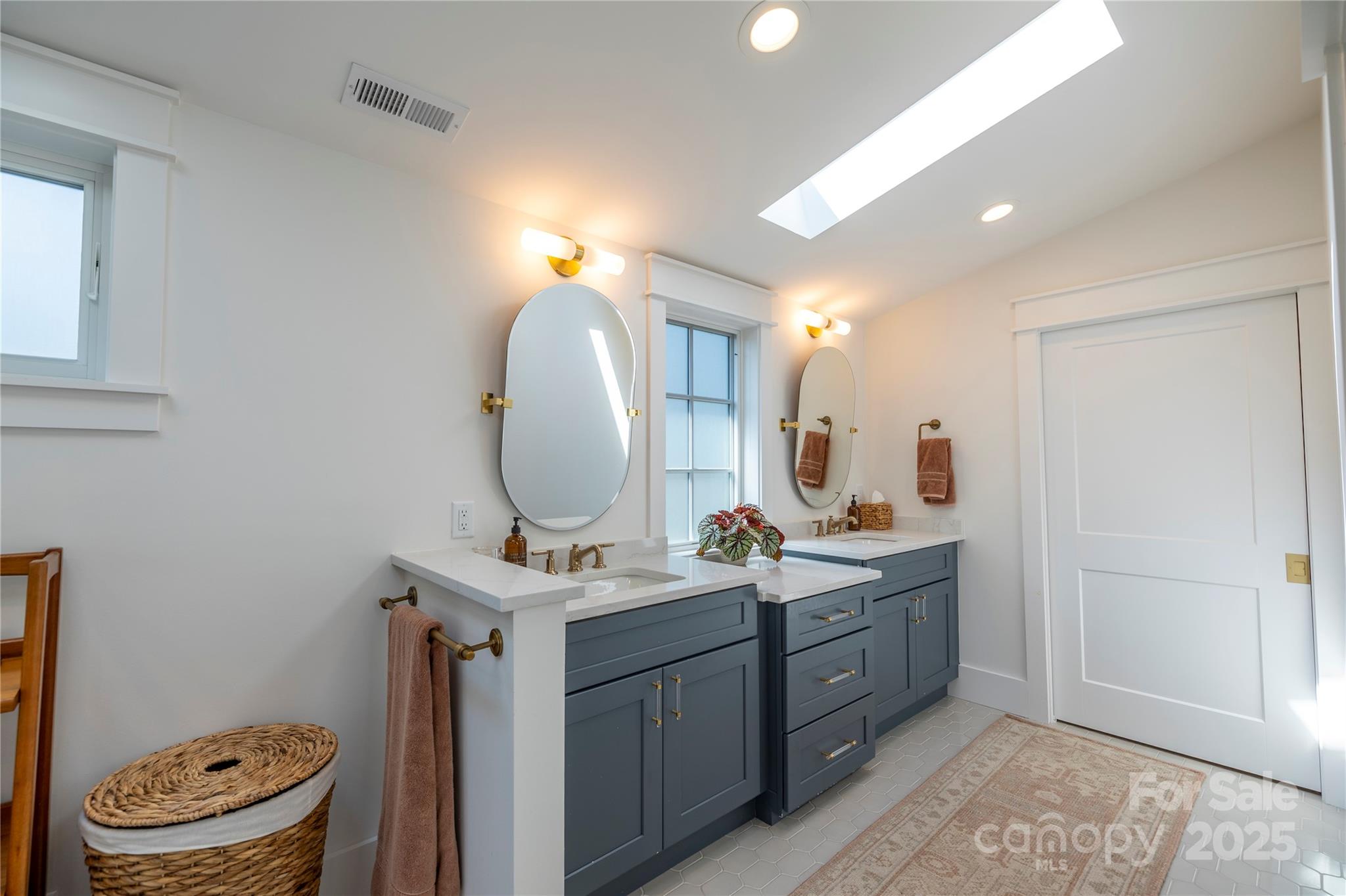 18353 John Connor Road Cornelius, NC 28031 - Photo 15 of 47 a bathroom with a double vanity sink mirror and toilet