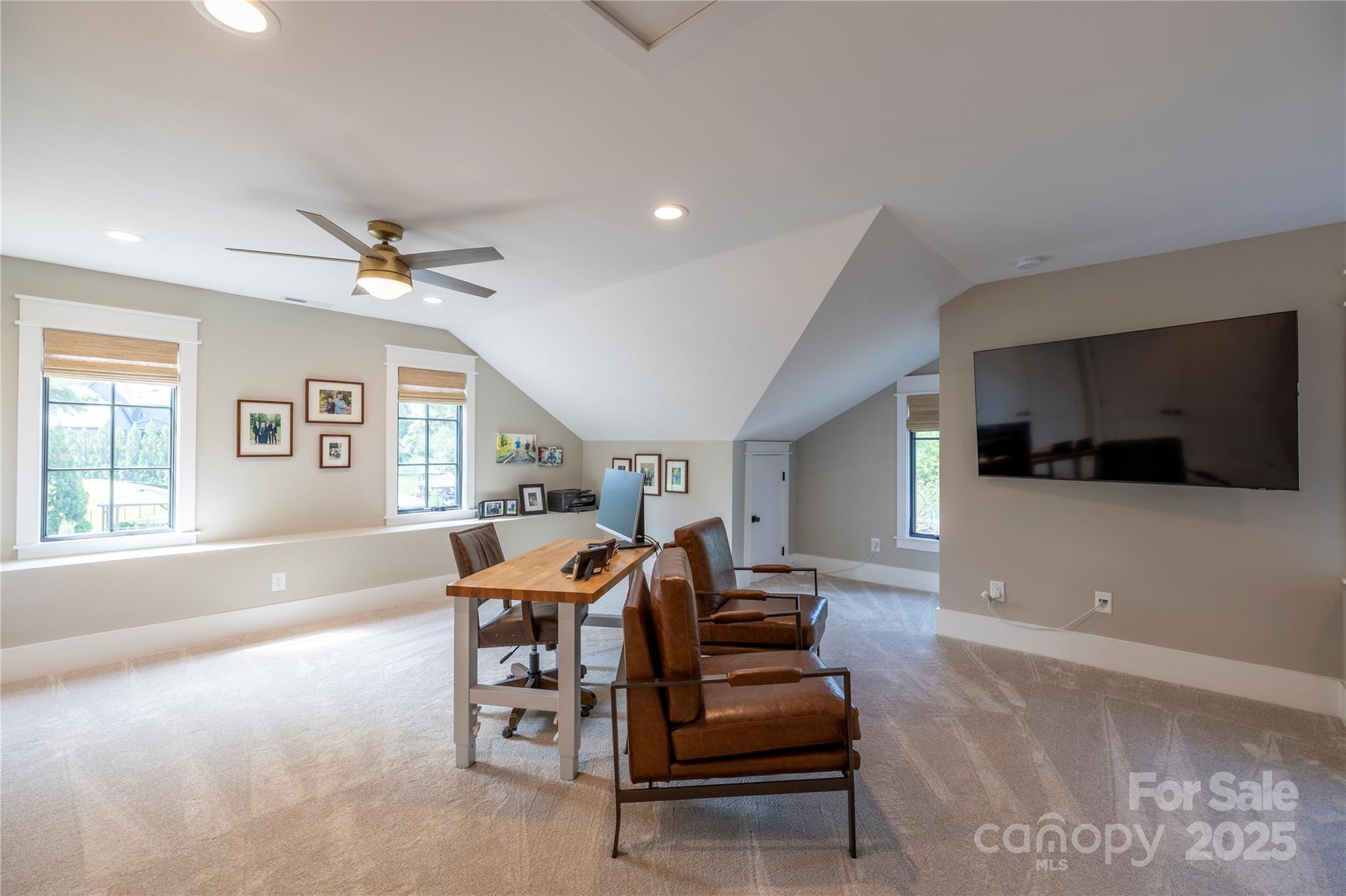 18353 John Connor Road Cornelius, NC 28031 - Photo 19 of 47 a living room with furniture and a flat screen tv