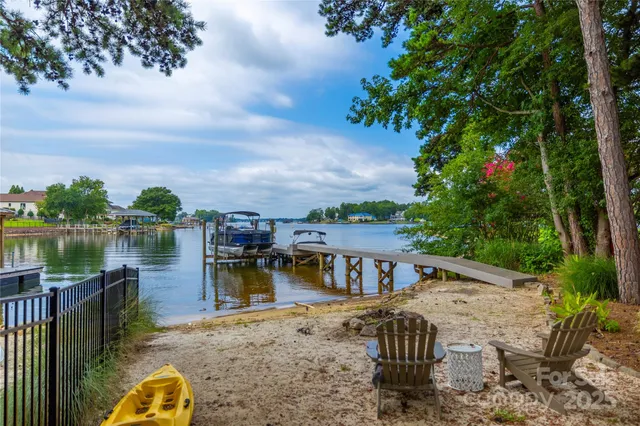 a view of a lake with a house in the background