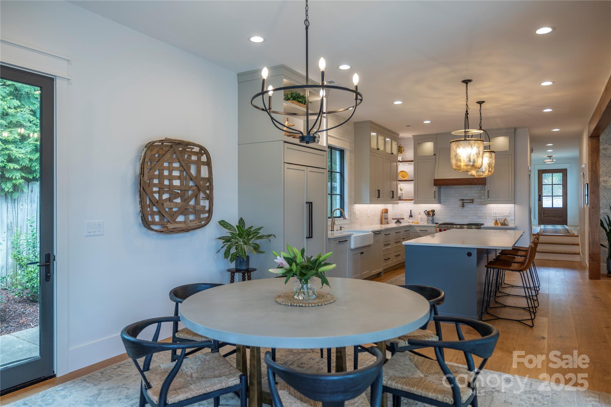 18353 John Connor Road Cornelius, NC 28031 - Photo 30 of 47 a view of a dining room with furniture window and wooden floor