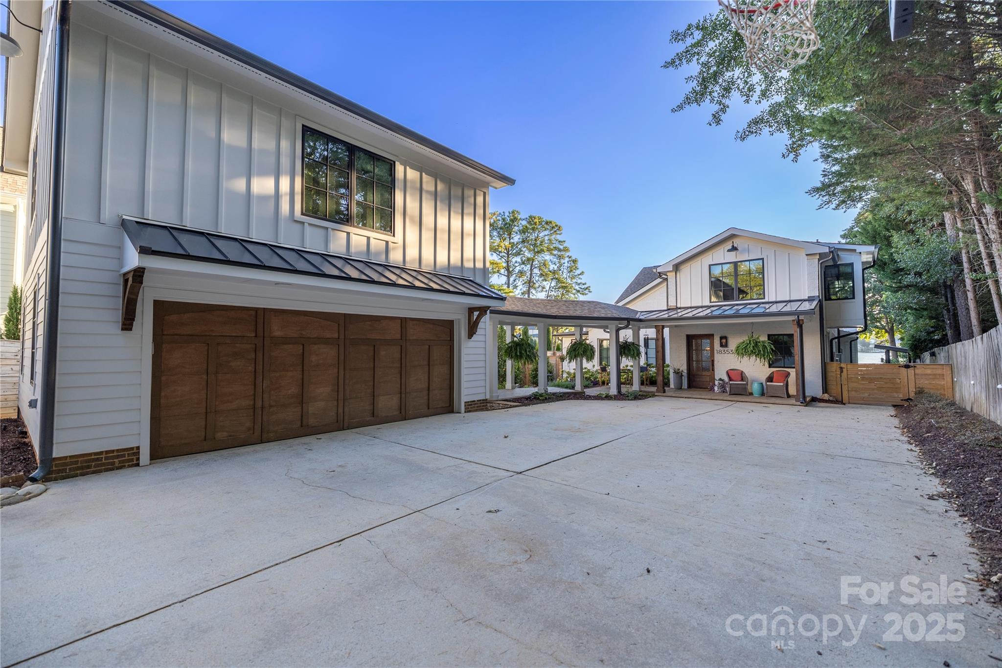 18353 John Connor Road Cornelius, NC 28031 - Photo 31 of 47 a front view of building with yard