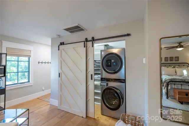 a view of storage and utility room with washer and dryer