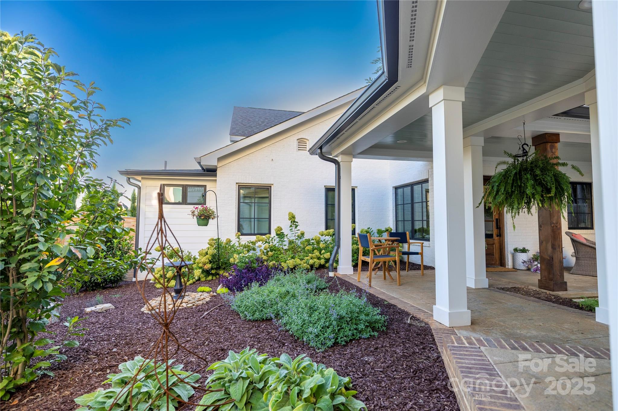 18353 John Connor Road Cornelius, NC 28031 - Photo 42 of 47 a view of a porch with chairs and potted plants