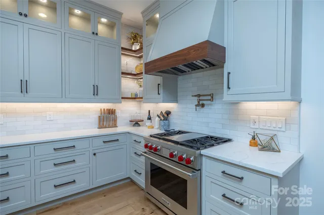 a kitchen with cabinets and appliances