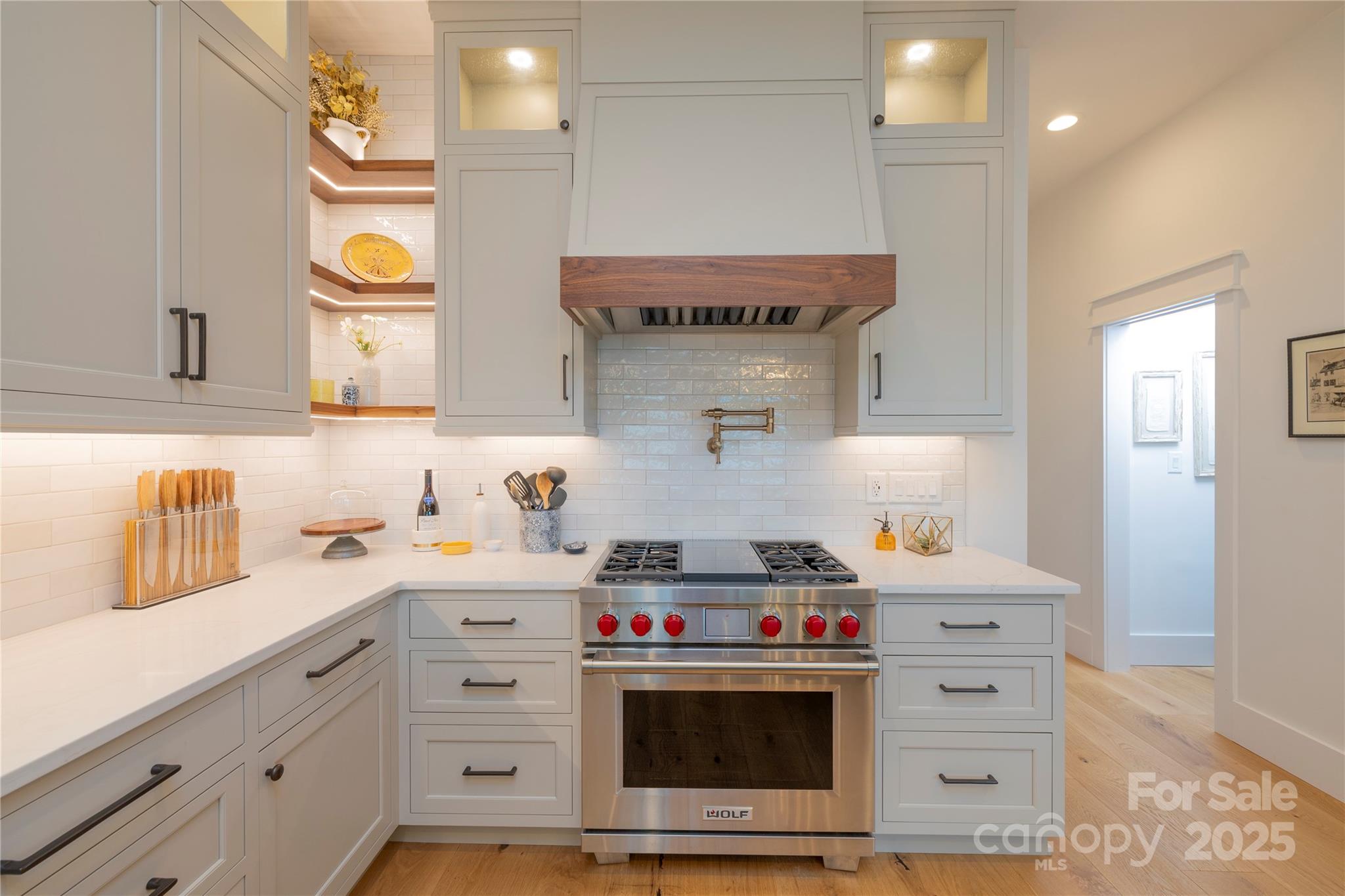 18353 John Connor Road Cornelius, NC 28031 - Photo 7 of 47 a kitchen with cabinets and stainless steel appliances
