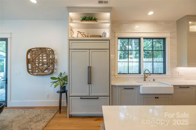a bathroom with a bathtub and a potted plant
