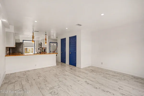 a kitchen with stainless steel appliances a stove and a microwave
