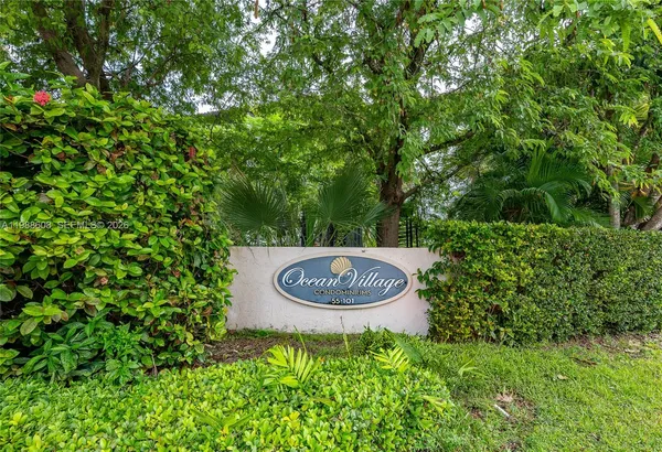 a view of a backyard with plants and a garden