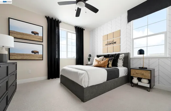 a spacious bedroom with a bed and window