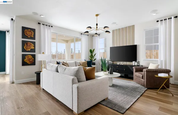 a living room with fireplace furniture and a flat screen tv