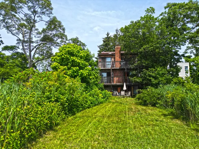 a view of balcony with yard