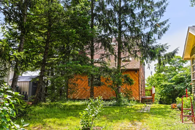 a backyard of a house with lots of green space