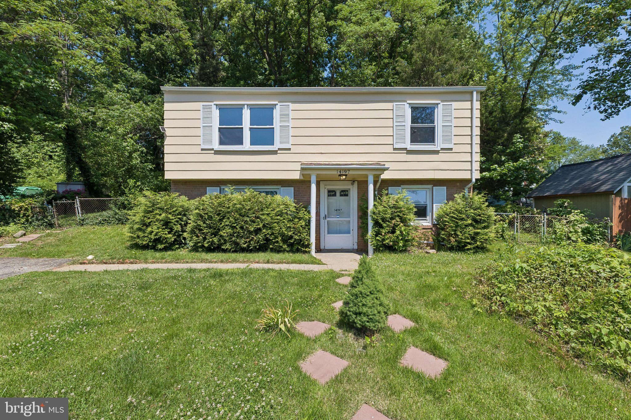 14197 Fullerton Road Woodbridge, VA 22193 - Photo 2 of 23 a house that has a lot of plants in it