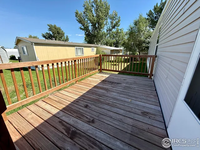 a view of deck with wooden floor and outdoor seating