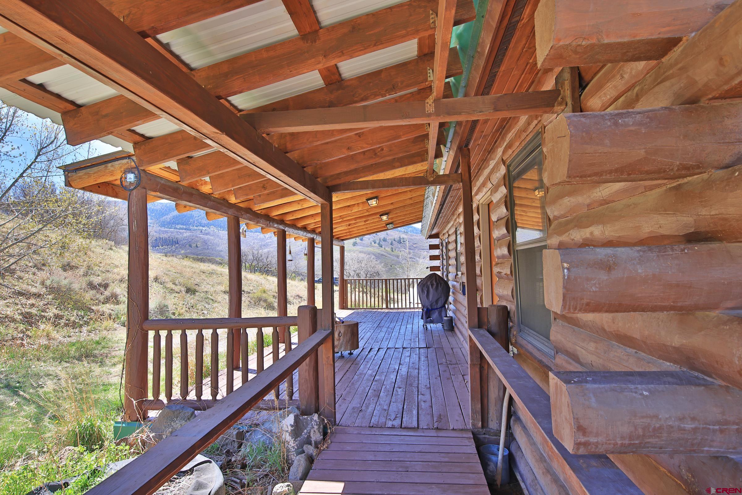 10822 60 75/100 Road Collbran, CO 81624 - Photo 28 of 45 a view of balcony with wooden floor