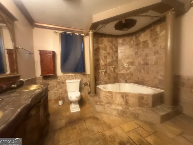 a view of a livingroom with wooden floor and window