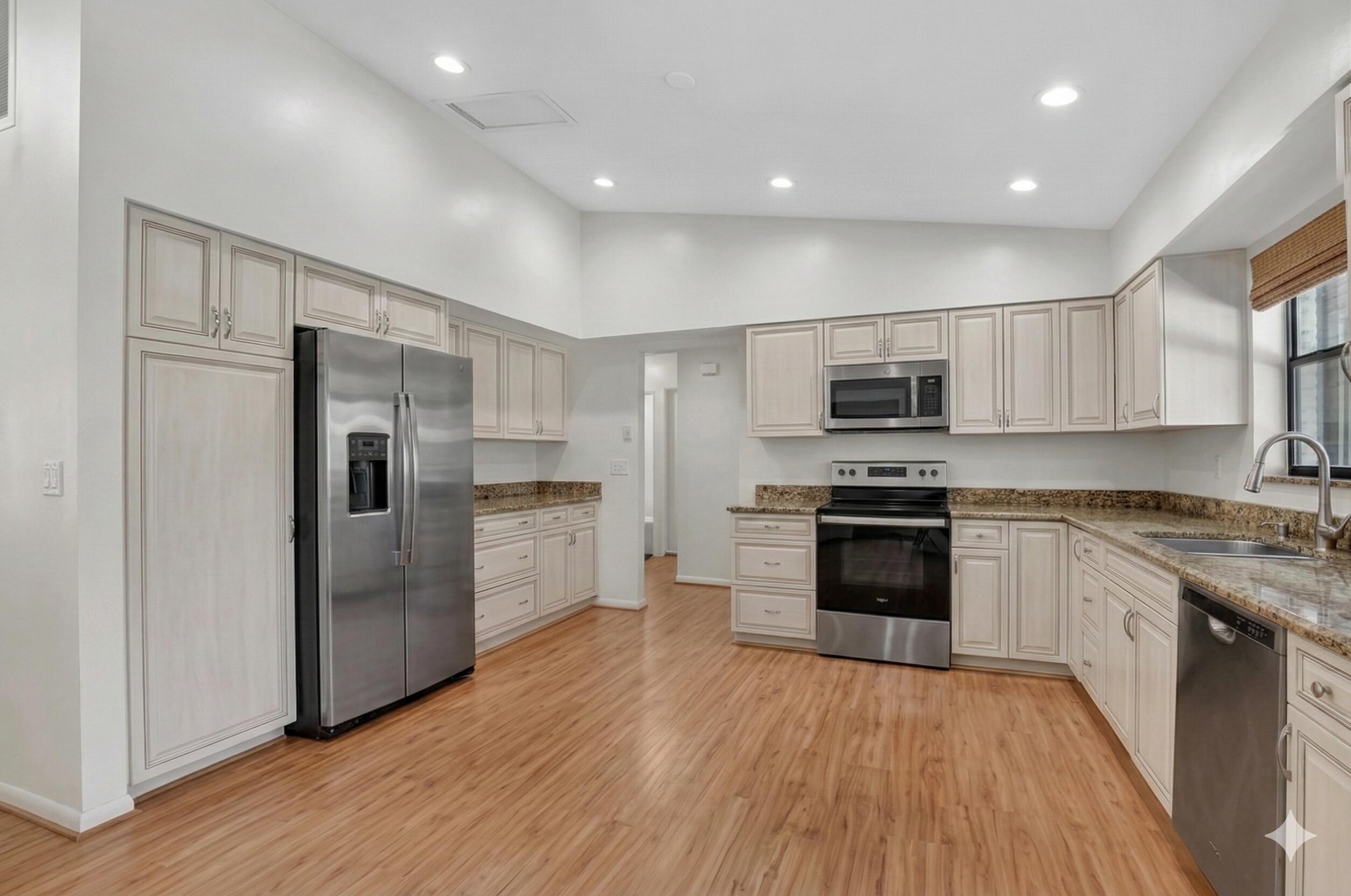 22220 Morning Glory Terrace Boca Raton, FL 33433 - Photo 15 of 69 a kitchen with stainless steel appliances a refrigerator a stove top oven and cabinets