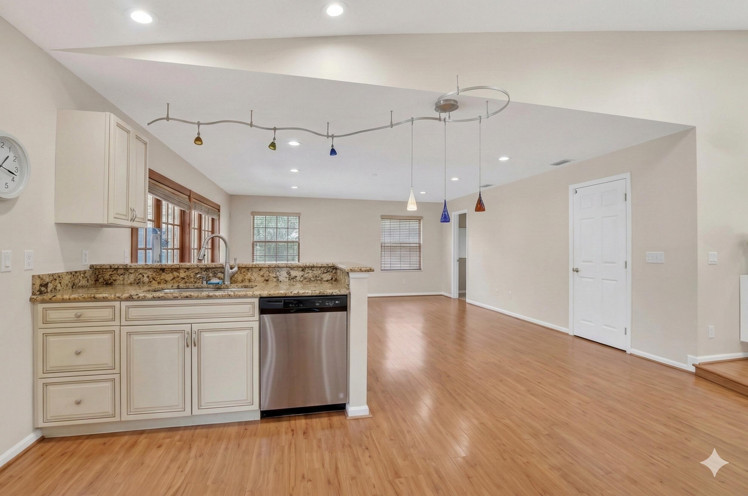 22220 Morning Glory Terrace Boca Raton, FL 33433 - Photo 19 of 69 a kitchen with kitchen island granite countertop a sink cabinets and wooden floor